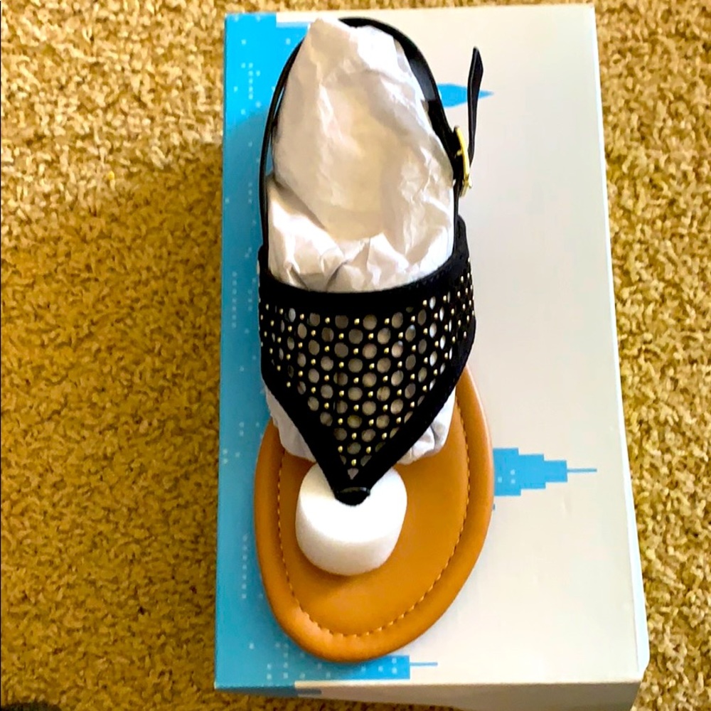 Black sandal with gold accents